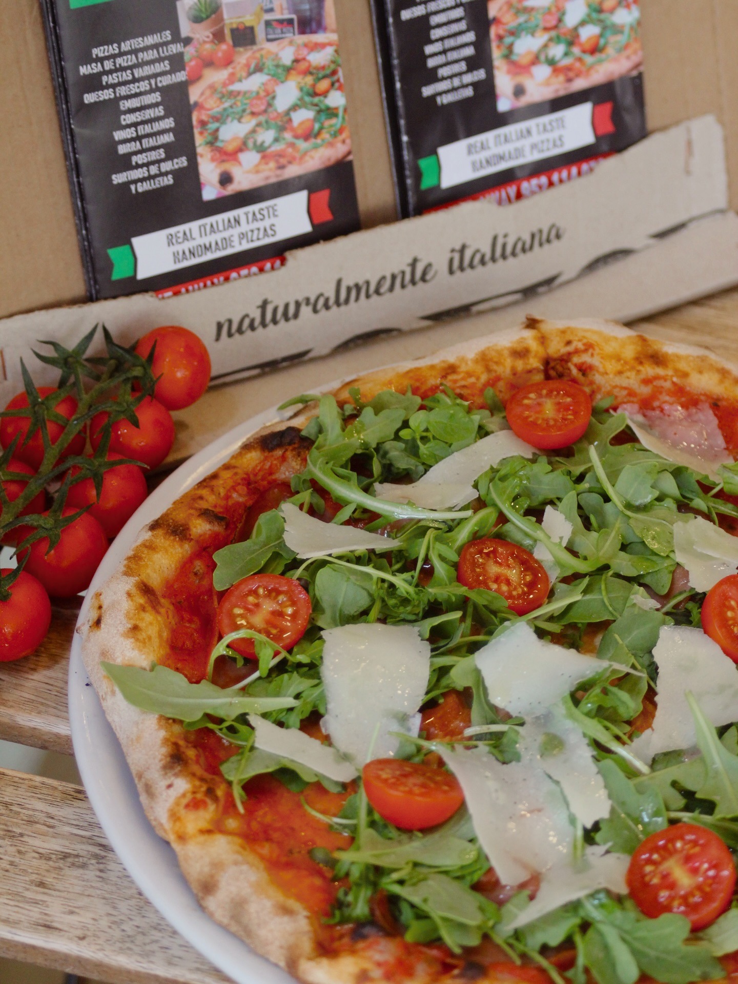 San Daniele pizza with cherry tomatoes and pizza box