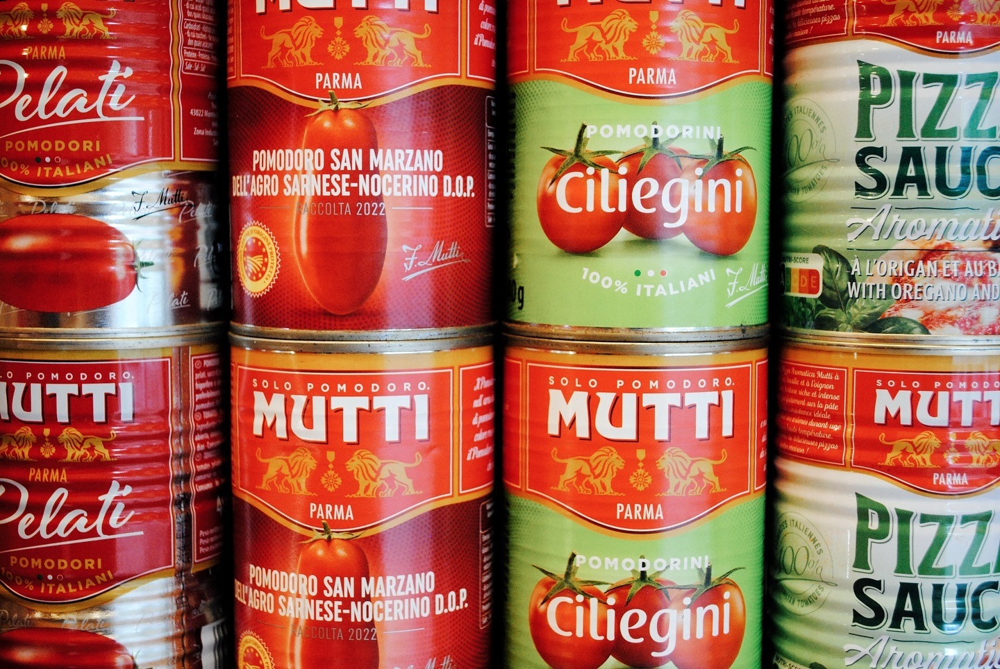 Stacked tins of Italian San Marzano tomatoes